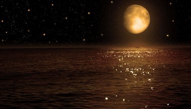 Sonhar com praia à noite