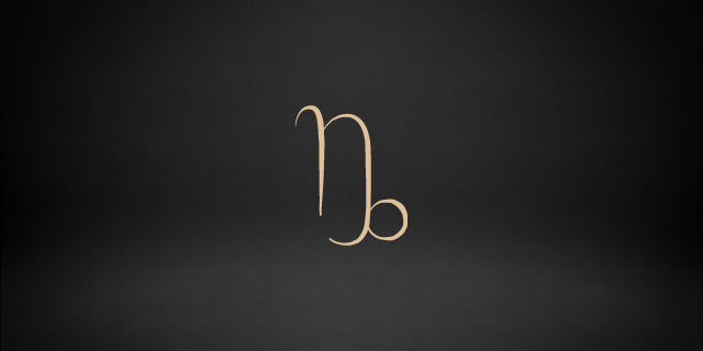 preto com o símbolo de capricórnio 