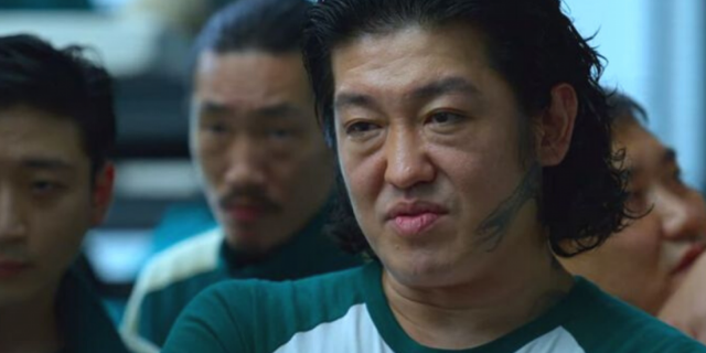 Imagem do personagem Jang Deok-su durante a série Round 6