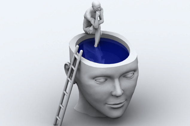 Escultura 3D de um cérebro aberto e um humano sentado na beira