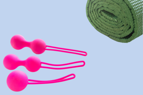 Instrumentos de pompoarismo e um tapete de yoga